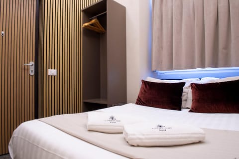 Bed, Photo of the whole room, Decorative detail, Bedroom, towels, wardrobe