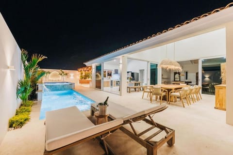 Patio, Night, Living room, Seating area, Dining area, Pool view, Swimming pool, sunbed