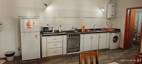 Kitchen or kitchenette, oven, stove, washing machine