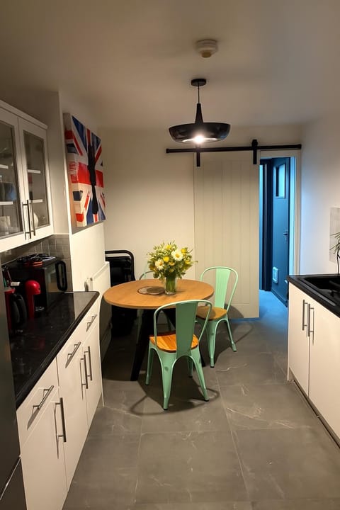 Kitchen or kitchenette, dishwasher, oven, stove