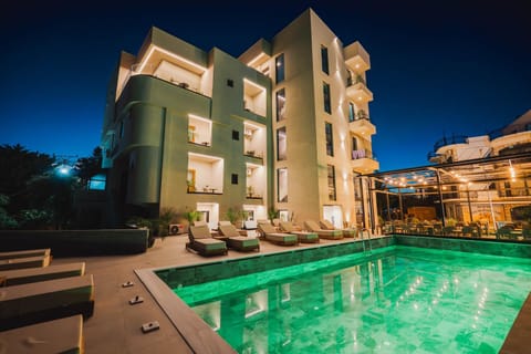 Property building, Patio, Night, Pool view, Swimming pool, sunbed