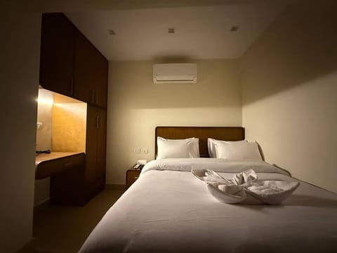 Bed, Photo of the whole room, Bedroom, towels, air conditioner