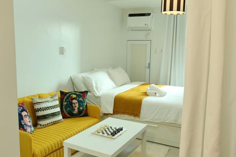 Bed, Living room, Photo of the whole room, Seating area, Bedroom, towels, air conditioner