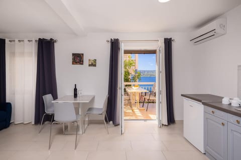 Kitchen or kitchenette, Living room, Seating area, Sea view, air conditioner