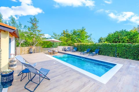 Patio, Natural landscape, Garden, Pool view, Swimming pool, sunbed