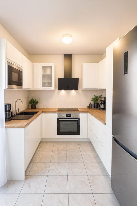Kitchen or kitchenette, dishwasher, oven, stove, toaster