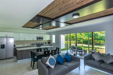Kitchen or kitchenette, Living room, Seating area, Dining area, dishwasher, oven, stove, toaster