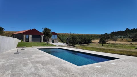 Property building, Day, Natural landscape, Pool view, Swimming pool, Swimming pool, sunbed
