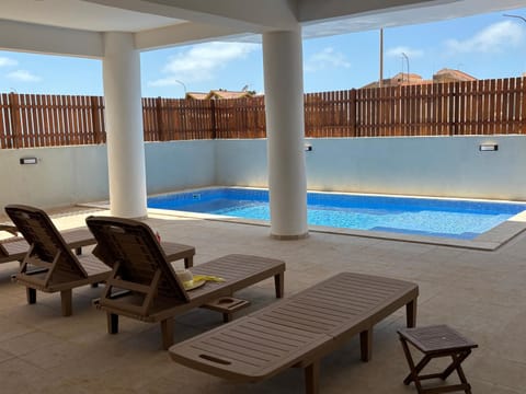 Swimming pool, sunbed