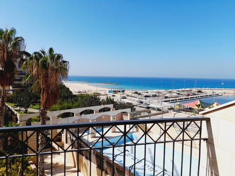 View (from property/room), Balcony/Terrace, Pool view, Sea view, Swimming pool
