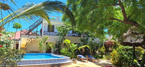 Property building, Patio, Day, Garden, Garden view, Pool view, Swimming pool, sunbed