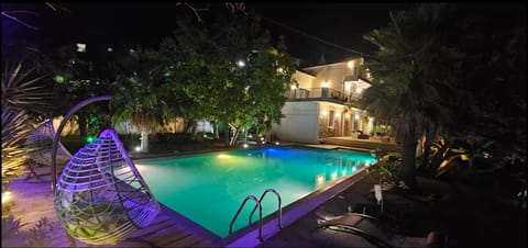 Property building, Night, Garden, Swimming pool, Swimming pool, sunbed