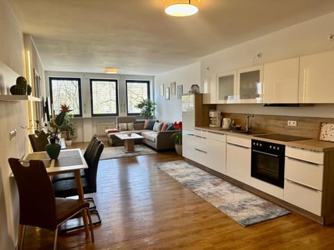 Kitchen or kitchenette, Living room, Seating area, Dining area