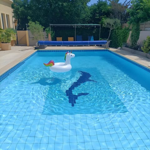 Property building, Living room, Swimming pool