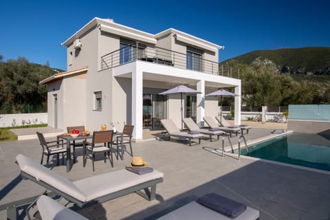 Property building, Patio, Dining area, Swimming pool