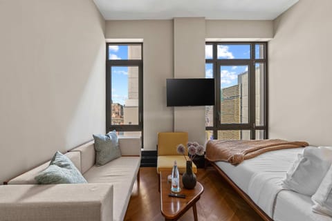 Bed, TV and multimedia, Seating area, Bedroom