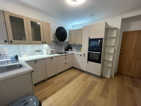 Kitchen or kitchenette, dishwasher, oven, stove, toaster