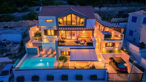 Property building, Patio, Night, Pool view, Swimming pool, sunbed