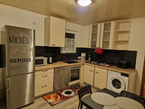 Kitchen or kitchenette, washing machine