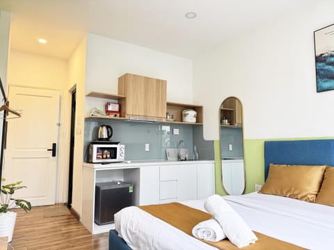 Kitchen or kitchenette, Bedroom, microwave, stove, towels