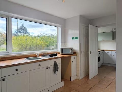 Kitchen or kitchenette, dishwasher, washing machine, dryer