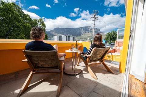 Patio, People, View (from property/room), Balcony/Terrace, Seating area, Dining area, Guests, Mountain view
