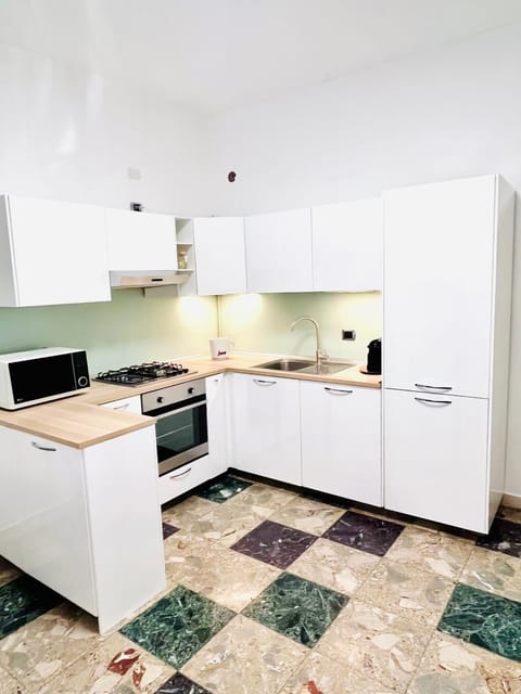 Kitchen or kitchenette, dishwasher, oven, stove