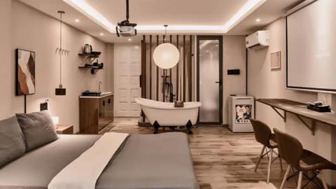 Bed, TV and multimedia, Kitchen or kitchenette, Living room, Photo of the whole room, Seating area, Bedroom, air conditioner