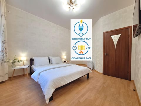Bed, Property logo or sign, Photo of the whole room, Logo/Certificate/Sign, Bedroom, Text overlay, Certificate/Award