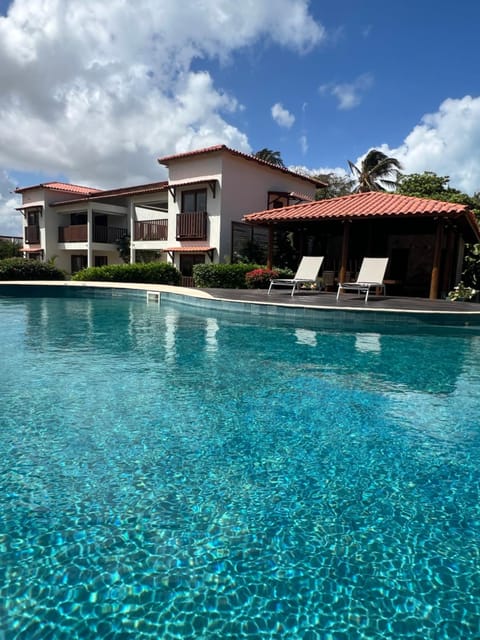 Property building, Day, Pool view, Swimming pool, sunbed