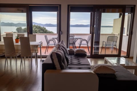 View (from property/room), Balcony/Terrace, Living room, Seating area, Dining area, Sea view