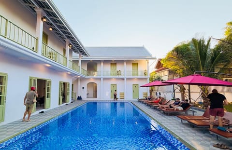 Swimming pool, group of guests, sunbed