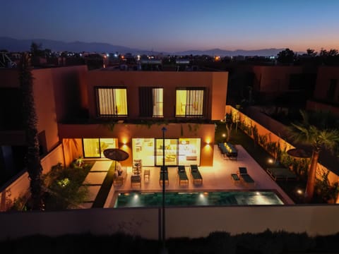 Patio, Night, Pool view, sunbed