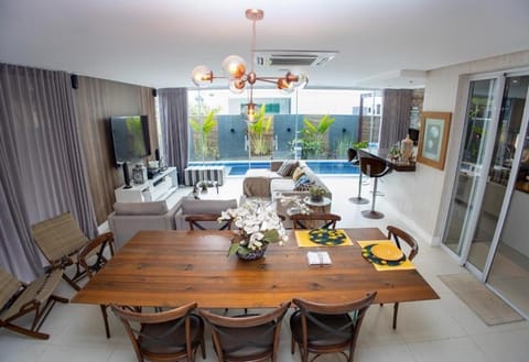 Patio, Living room, Seating area, Dining area, Pool view