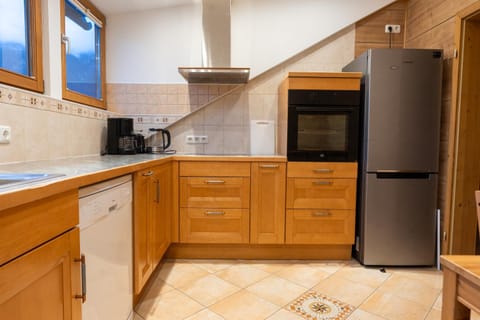 Kitchen or kitchenette, dishwasher, oven, stove