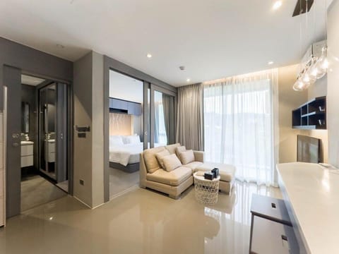 Bed, TV and multimedia, Living room, Seating area, Bedroom, air conditioner