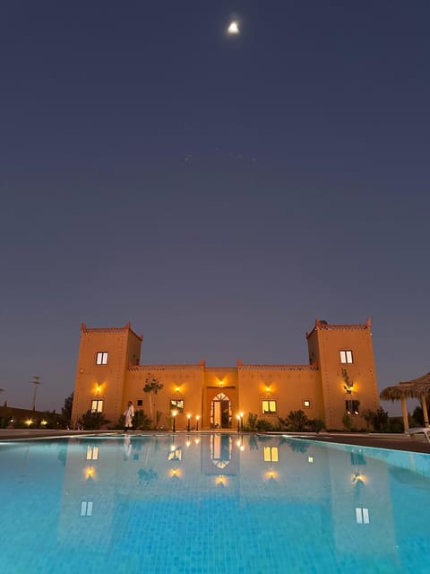 Property building, Night, Pool view, Swimming pool, Swimming pool, sunbed