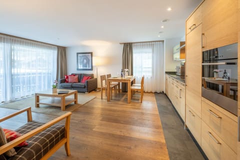 Kitchen or kitchenette, Living room, Seating area, stove