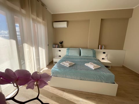 Bed, Photo of the whole room, Bedroom, towels, air conditioner