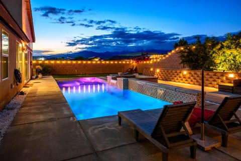 Property building, Patio, Night, Seating area, Mountain view, Pool view, Swimming pool, sunbed