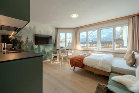 Bed, Natural landscape, TV and multimedia, Kitchen or kitchenette, Living room, Photo of the whole room, Seating area, Dining area, Bedroom