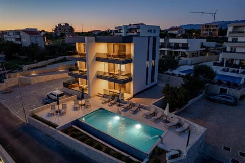 Property building, Patio, Night, Balcony/Terrace, Pool view, Swimming pool