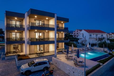 Property building, Patio, Night, Pool view, Swimming pool, Parking, sunbed