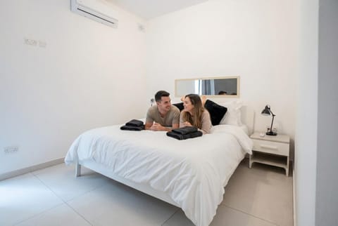 Bed, People, Bedroom, group of guests, towels, air conditioner