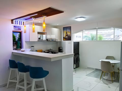 Kitchen or kitchenette, Dining area, microwave, washing machine, dryer