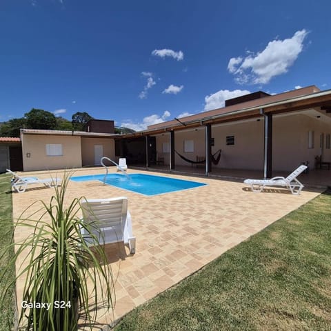 Property building, Patio, Pool view, Swimming pool, sunbed