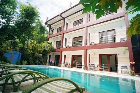 Property building, Patio, Day, Garden, View (from property/room), Balcony/Terrace, Garden view, Pool view, Swimming pool, sunbed