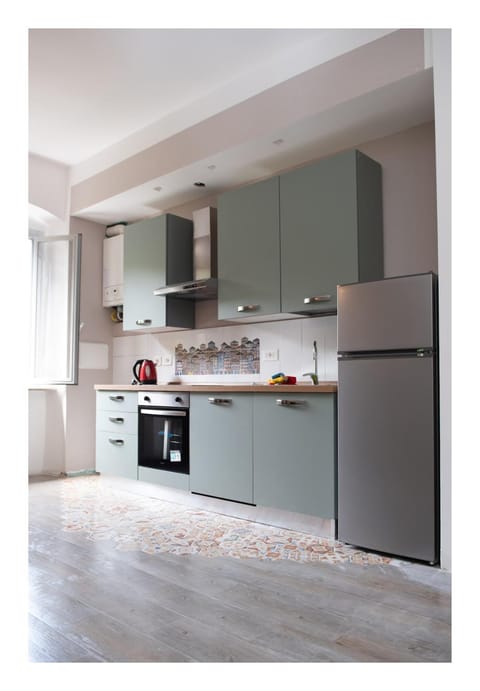 Kitchen or kitchenette, dishwasher, oven, stove