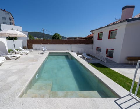 Property building, Pool view, Swimming pool, sunbed