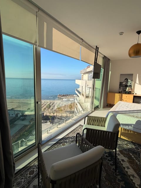 View (from property/room), Balcony/Terrace, Living room, Seating area, Sea view